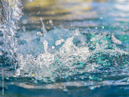 Splashing Turquoise Water / Close up of water splashing into turquoise & blue pool water.  © Terry Walsh Photo