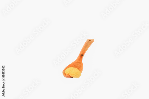 Cookies onto wooden spoon on white background