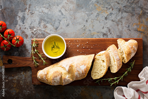 Homemade baguette with olive oil and salt photo