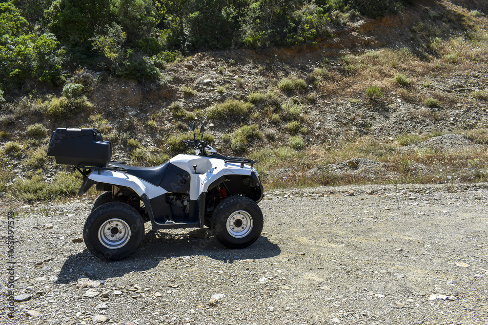 ATV offroad on mountain and sky background. ATV offroad on mountain and sky background.