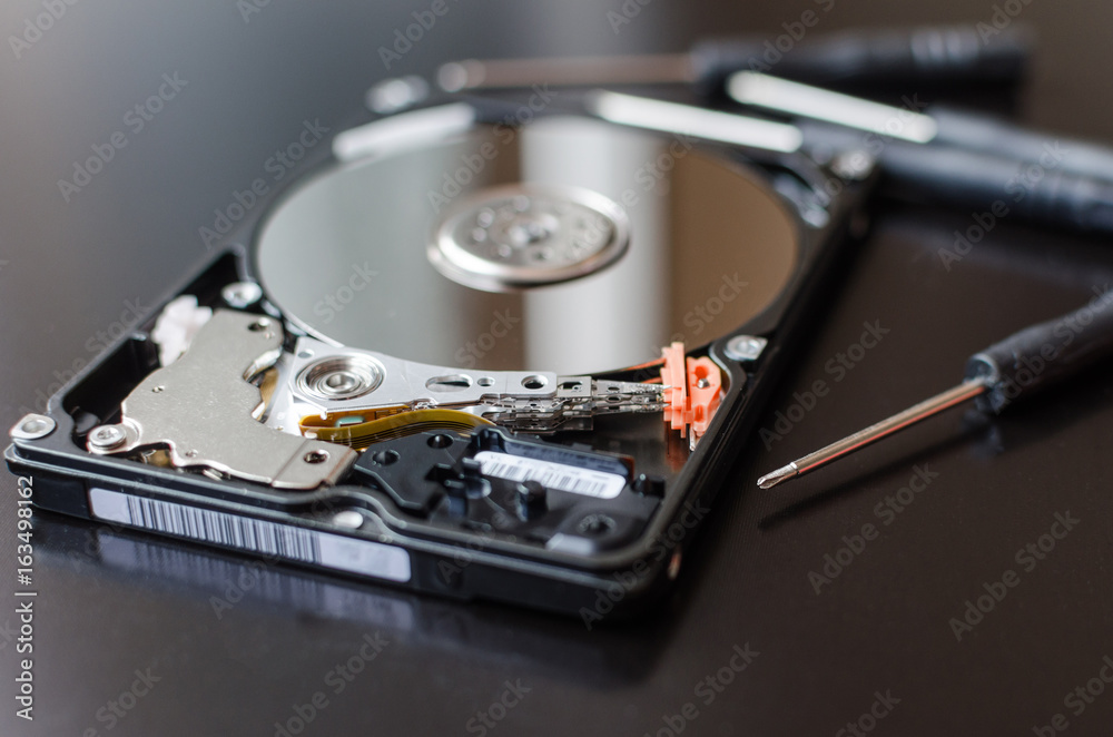 Repair of the dismantled hard drive. Hdd with mirror effect. Screwdrivers for computer repair. Repair of the dismantled hard drive. Hdd with mirror effect. Screwdrivers for computer repair.