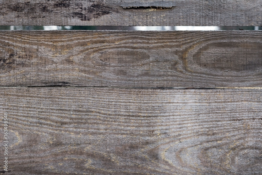 Naklejka premium Part of the fence with not polished boards