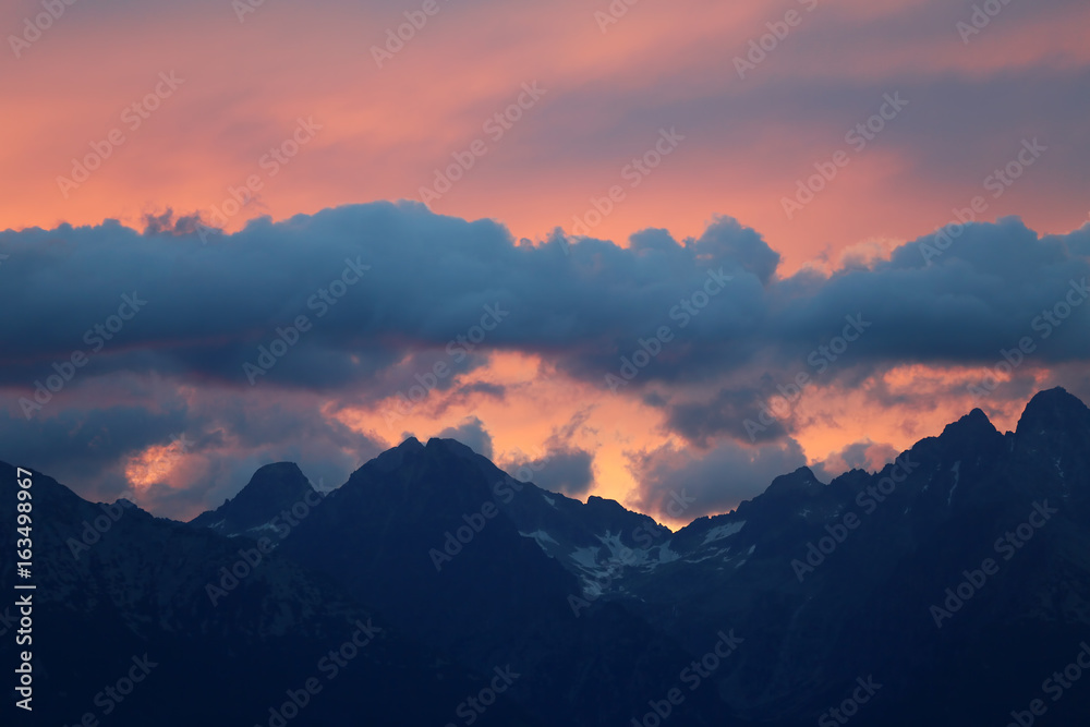 The tops of the mountains at sunset
