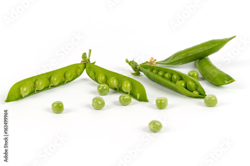 Green peas in pods isolated on white background