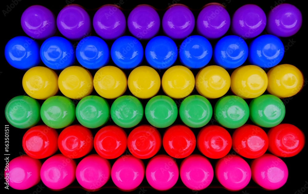 48 rainbow multi colored Spray can tops photographed from directly