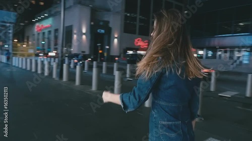 Girl shakes her hair and looks away slow motion photo