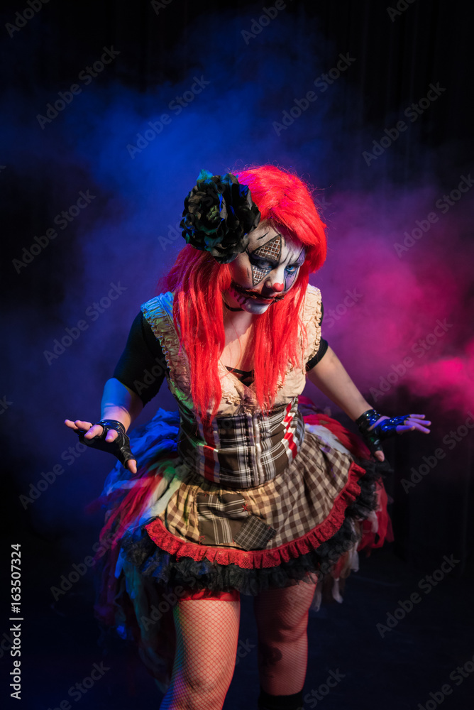 The queen of the carnival. An evil female clown character