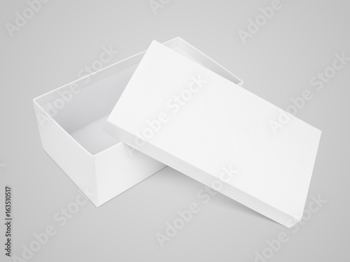 Opened shoe box with cover on gray background with clipping path
