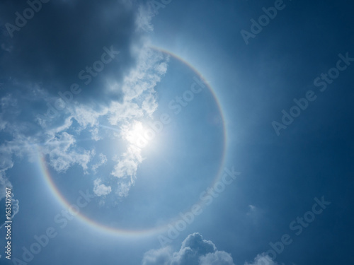 Circular Sun Halo in blue sky and cloud color like rainbow