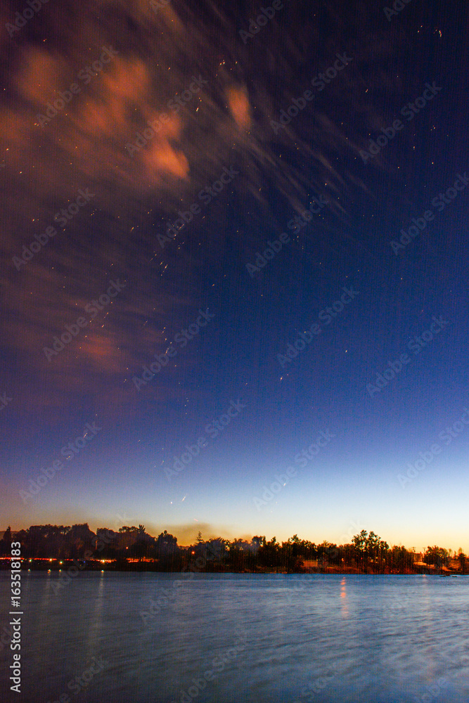 Stunning Fireworks above Lake in the Night