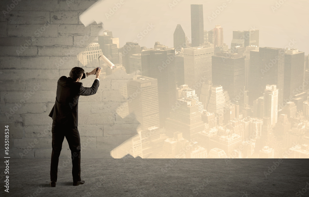 Salesman painting city scape on wall Salesman painting city scape on wall