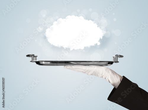 Hand holding clear big cloud on tray