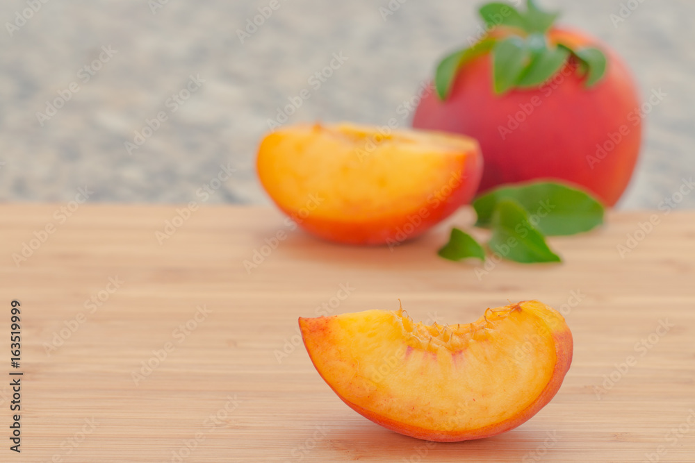  Ripe  peaches on cutting board.