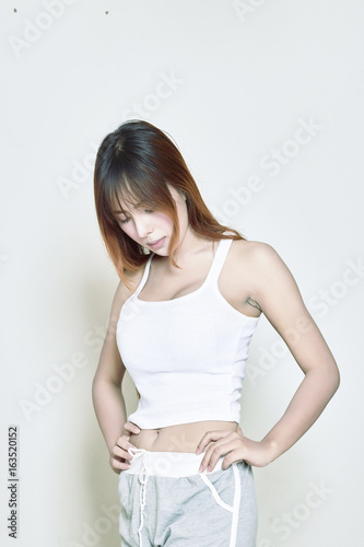 Asian woman unhappy in her body shape © Maxxx