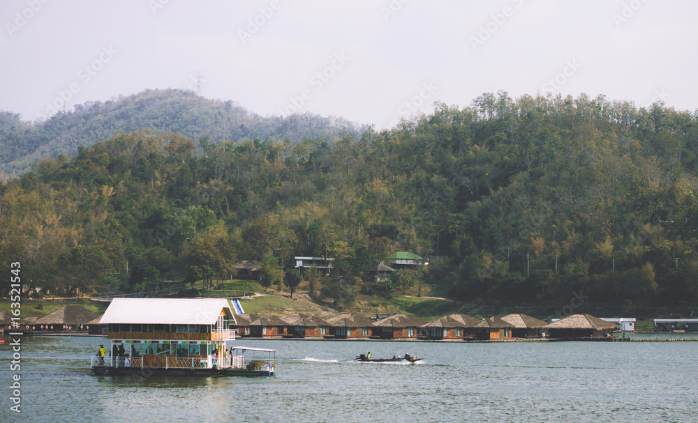 Resort wooden home raft floating and mountain fog on river kwai at sai yok,kanchanaburi,thailand