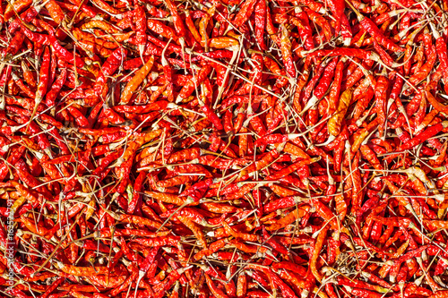 Hot and spicy Red Chilli ,Dried red chili,Pepper,Chillies as background for sale in a local food market,thai food ,close up,texture,spice medicinal properties.