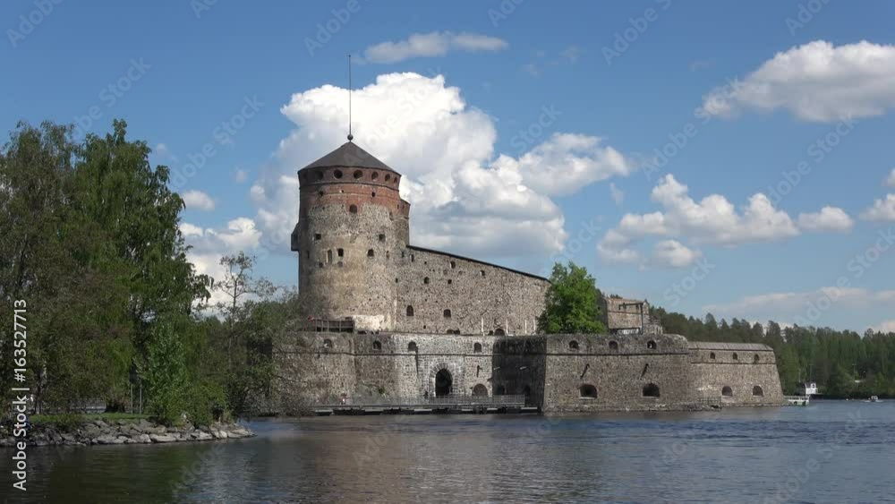 View of Olavinlinna castle from the water area of lake Pihlajavesi, june day. Savonlinna, Finland View of Olavinlinna castle from the water area of lake Pihlajavesi, june day. Savonlinna, Finland