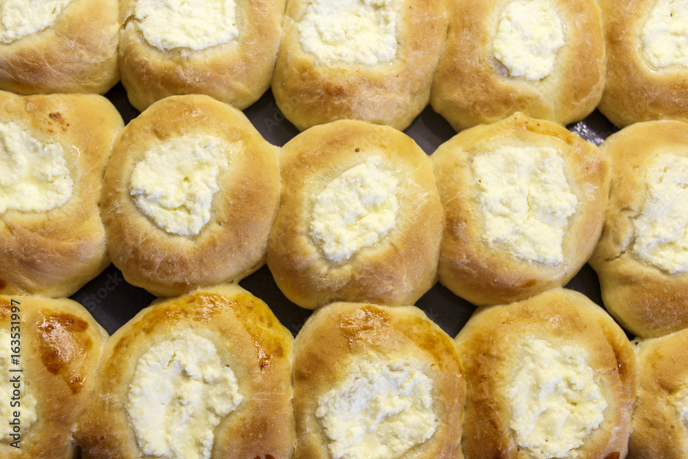 Round Russian scones with cottage cheese - vatrushka. Traditional Russian baking.
