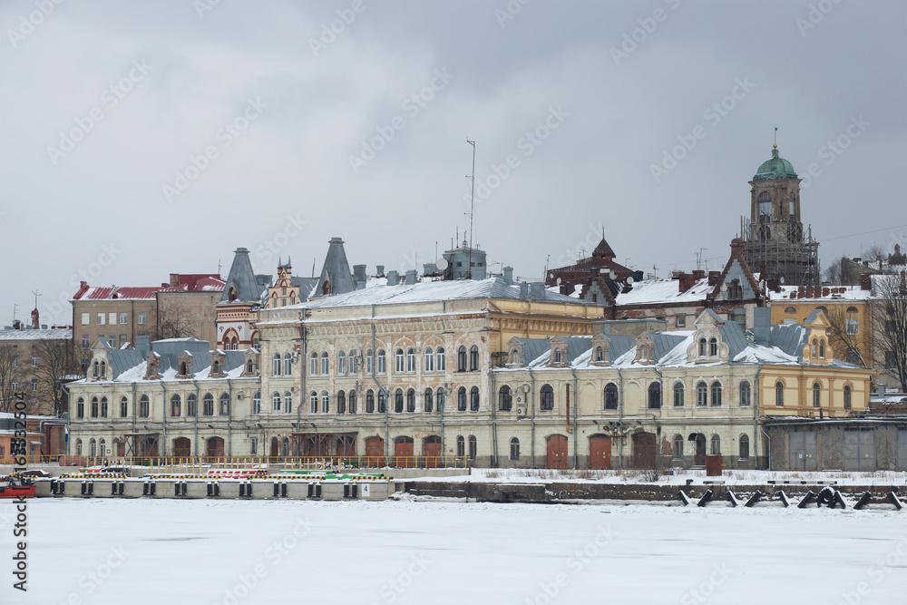 The old building of the cargo port administration in the gloomy February day. Vyborg, Russia