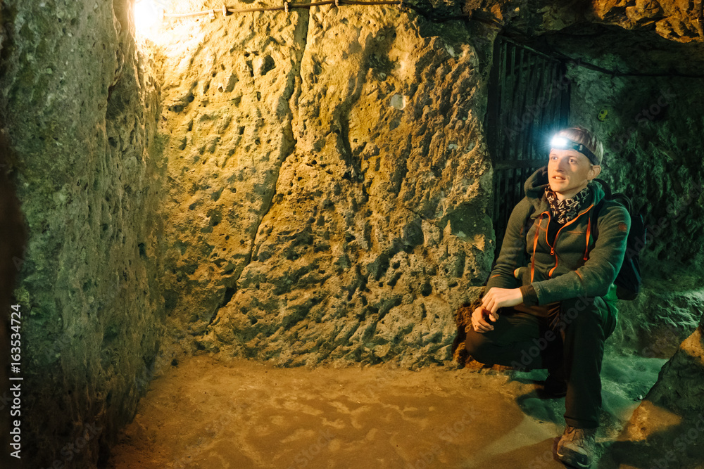 man exploring caves in Derinkuyu underground city