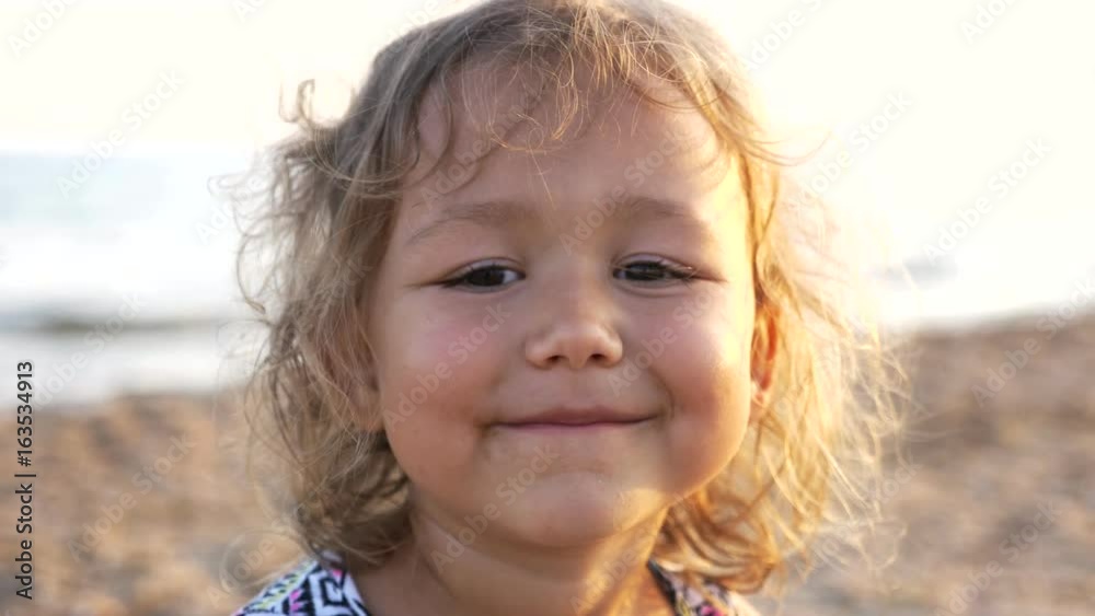 Close-up happy child face. Children in summer nature view at the beach, 4k Close-up happy child face. Children in summer nature view at the beach, 4k