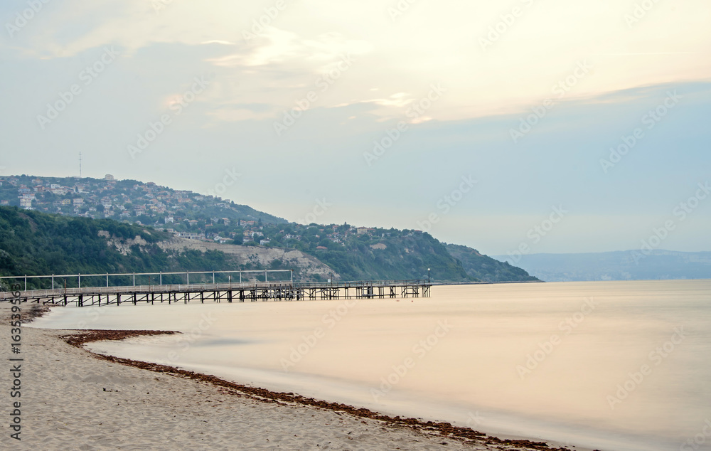 The Black Sea shore from Albena, Bulgaria with golden sands, sun, blue mystic water, seaside bridge near Kaliakra hotel