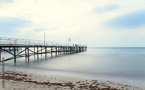 The Black Sea shore from Albena  Bulgaria with golden sands  sun  blue mystic water  seaside bridge near Kaliakra hotel