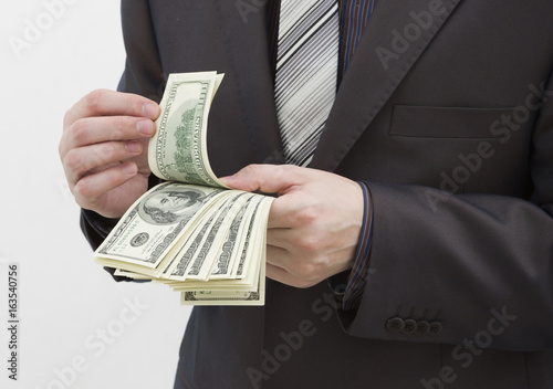 Successful businessman counts money