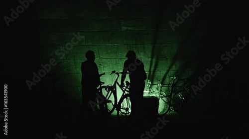 Urban Male Silhouettes On Bikes