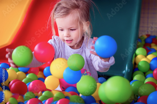 the child in small spheres plays