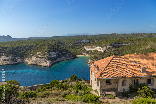 Corsica, France. An ancient building in the background of a picturesque bay in Bonifacio