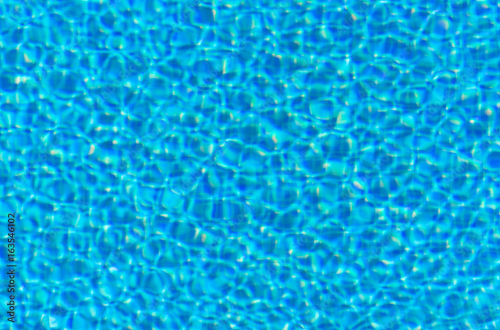 Blue rippled water in swimming pool