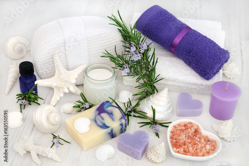 Rosemary herb flowers with aromatherapy  spa and bathroom accessories including moisturizing cream  essence  himalayan salt  soap  flannels  and decorative shells and pearls.