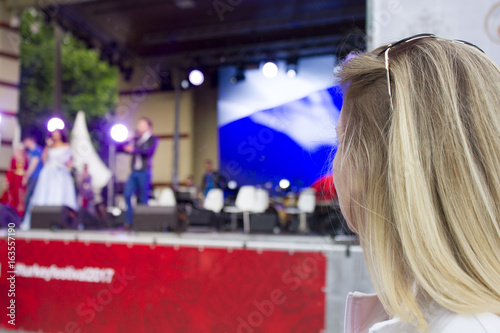 girl watching the concert