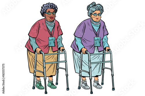 African and Caucasian old ladies with walker