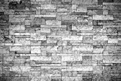 Puzzle brick grunge texture wall background. Haunt and horror. Rough and mess. Dark vignette. Black and white colors. Close up.