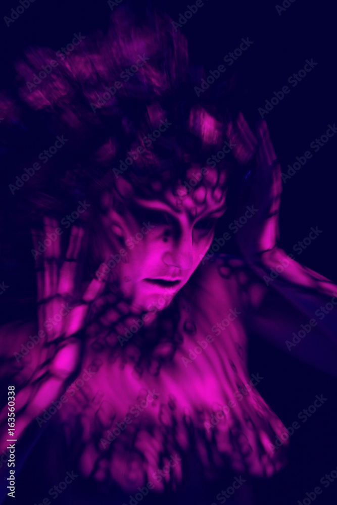 Freak girl in ultraviolet costume 