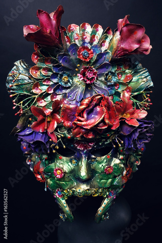 Mannequin in mask with with flowers © EVGENY FREEONE