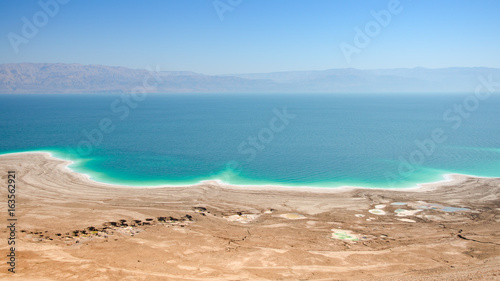 Fototapeta Naklejka Na Ścianę i Meble -  Dead Sea lake with salt water and curative mud shores beaches