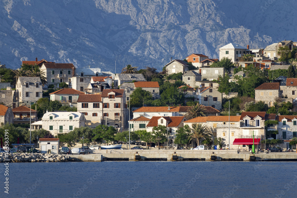 Picturesque village Sumartin on south-east of Brac island in Croatia, on the background Biokovo mountain