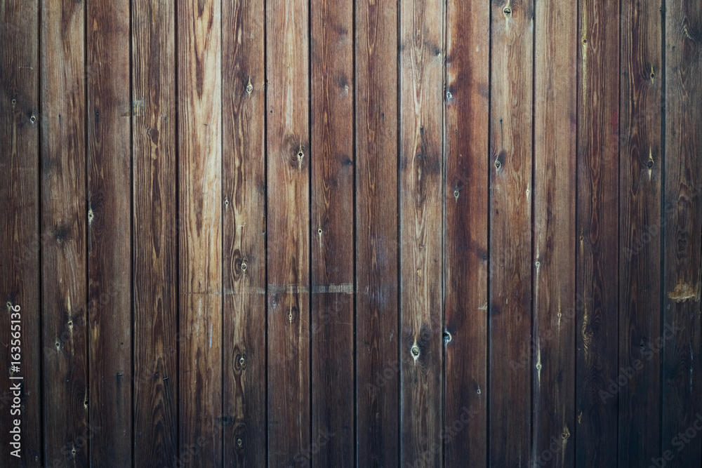 Naklejka premium Tło ciemnobrązowe deski drewniane, ogólny widok.