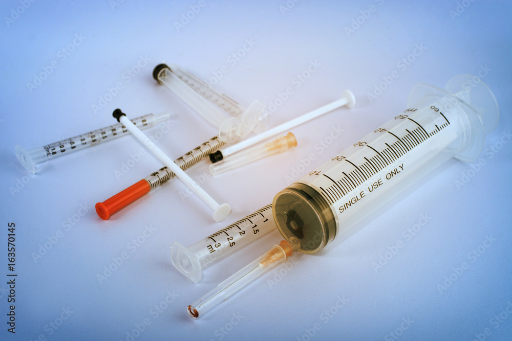 medical ampoules and syringe.(bluetone with sunshine color) medical ampoules and syringe.(bluetone with sunshine color)