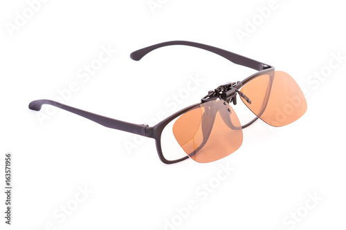Isolated Eyeglasses with clip on sunglasses on white background