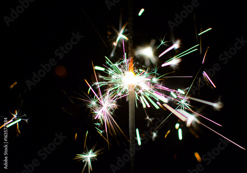 Colorful sparkler at night