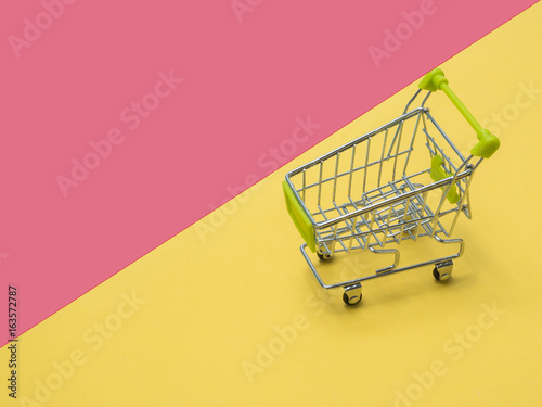 Collection of shopping cart full of shopping time.Top view or flat lay composition cart on color background.