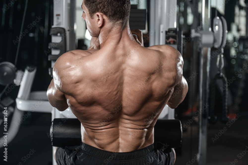 Strong bodybuilder man at the gym