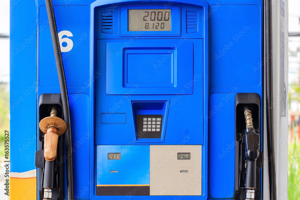 Close up of colorful fuel pumps/Fuel nozzle at gas station Close up of colorful fuel pumps/Fuel nozzle at gas station