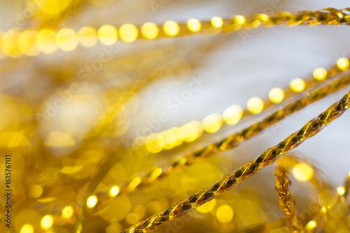 Golden textured tinsel rope macro shot 