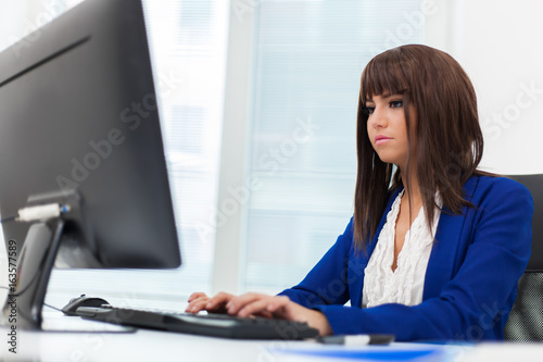 Young businesswoman working at her pc