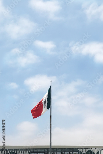  Mexican Border Wall. Mexican Flag at border crossing to Tijuana.